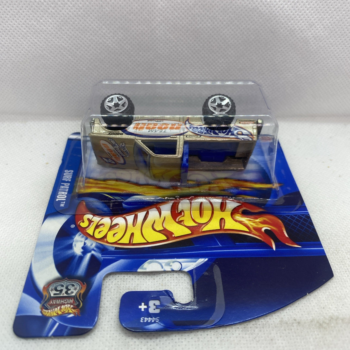 Hot Wheels die-cast truck in clear blister on blue card with flaming logo
