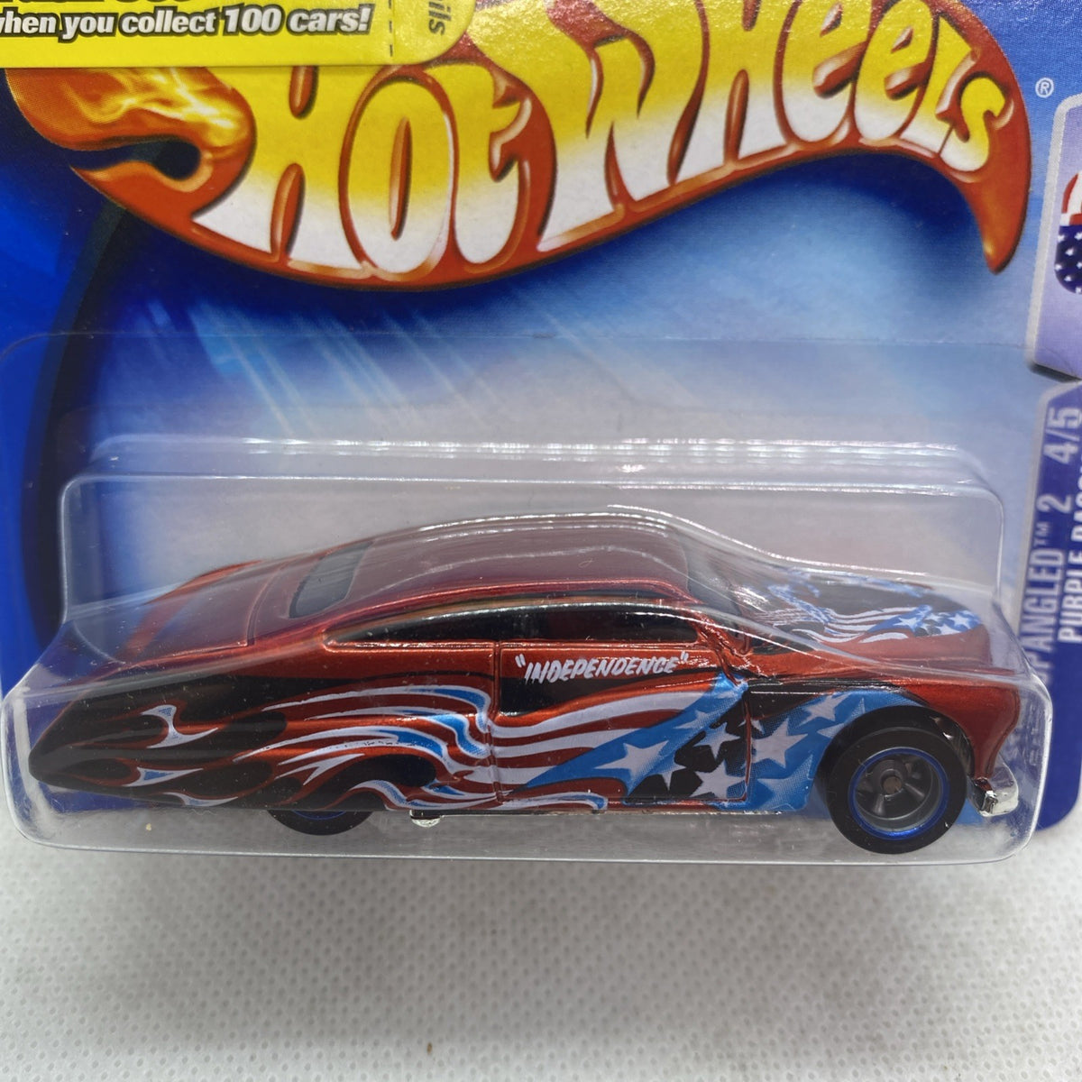 Hot Wheels Star Spangled toy car close-up, red/black flames with Independence badge