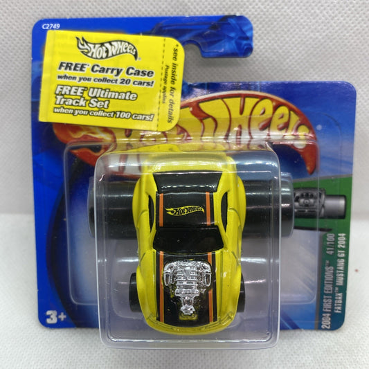 Yellow Mustang GT toy car in clear blister pack on blue Hot Wheels card