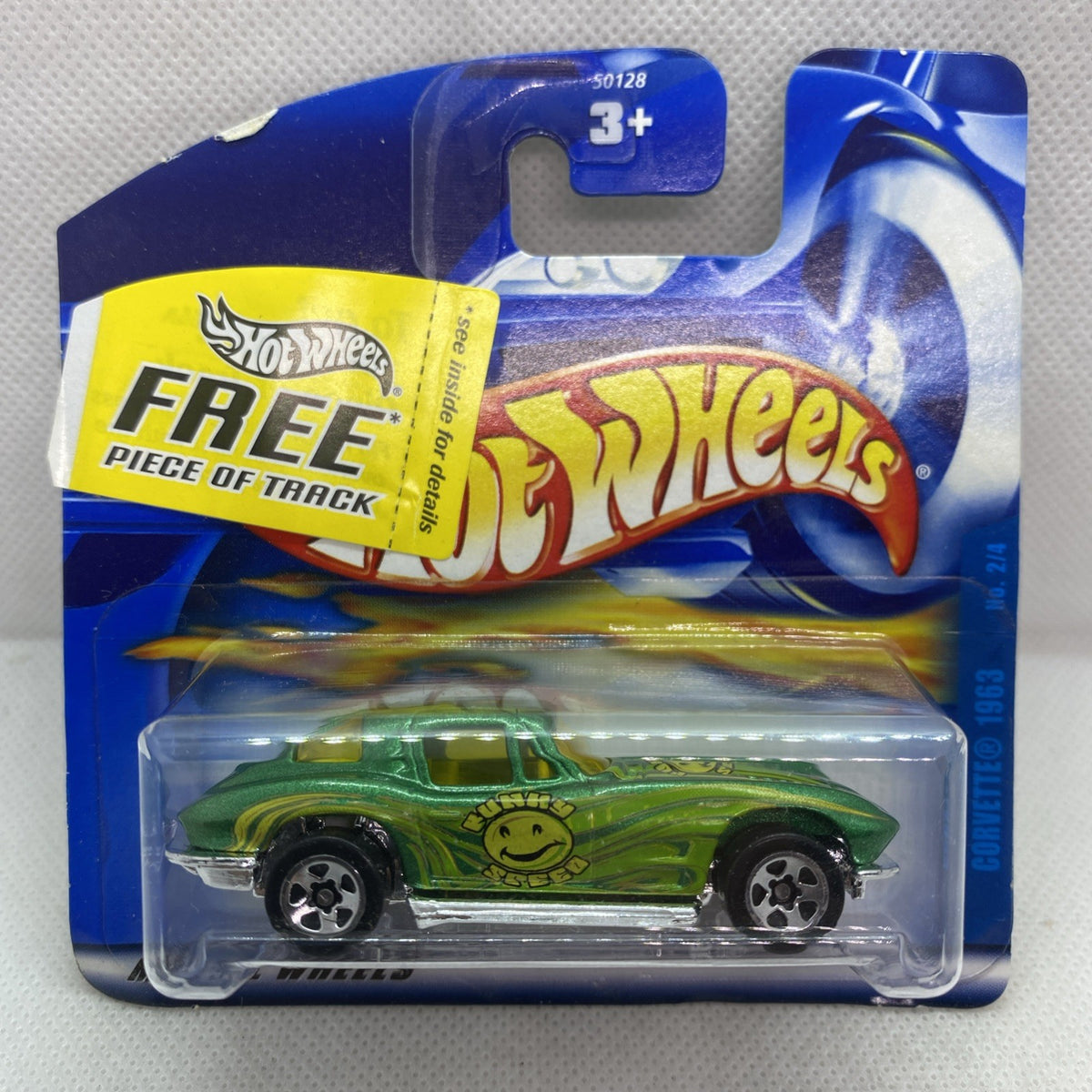Sealed Hot Wheels green die-cast car in clear blister on blue card