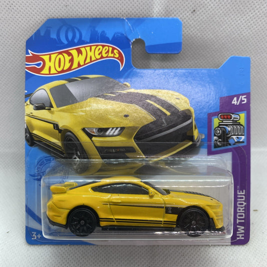 Yellow and black die-cast muscle car in blister card, front 3/4 view